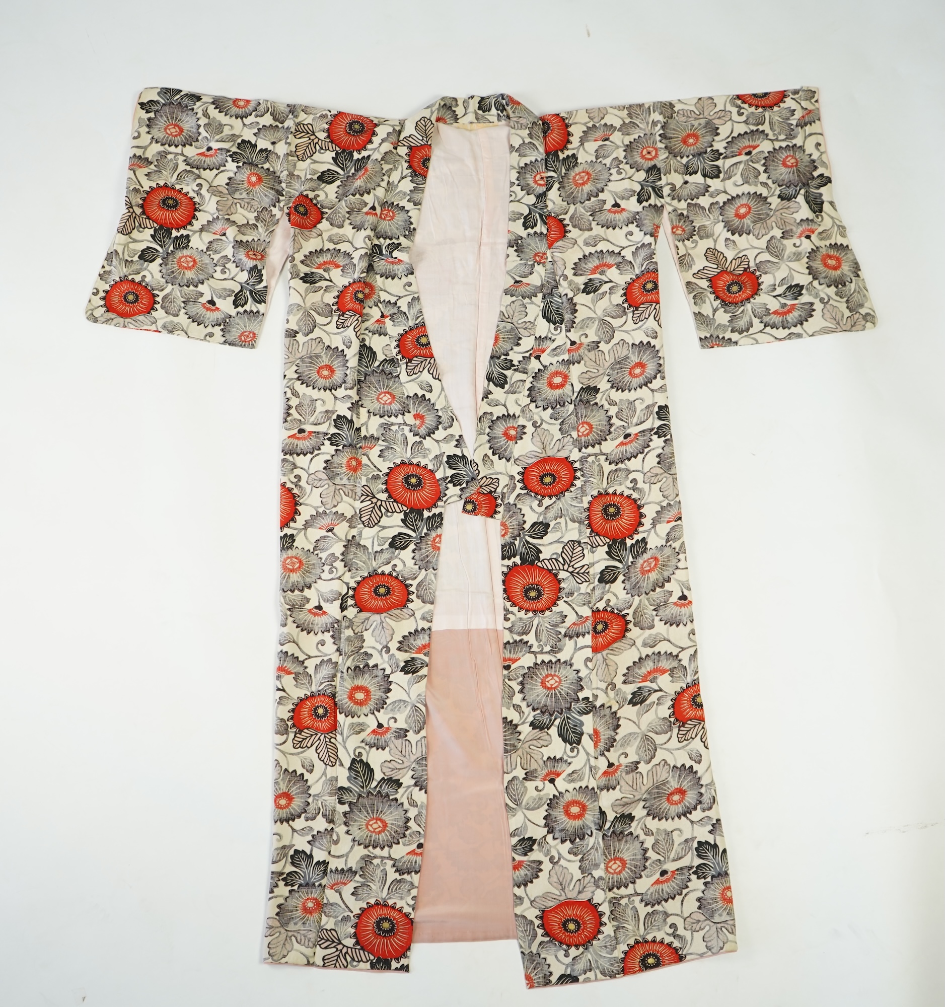 Four 1930’s - 1950’s printed silk full length silk lined Japanese kimonos. Two floral and two geometric in design. Longest black and orange floral designed kimono, 150cm long. Condition - purple and pink check kimono the